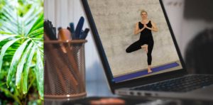 Image of yoga practitioner on a laptop computer.