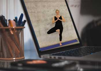 Photo of laptop streaming yoga.