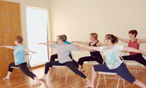 Photo of a group during a chair yoga class.